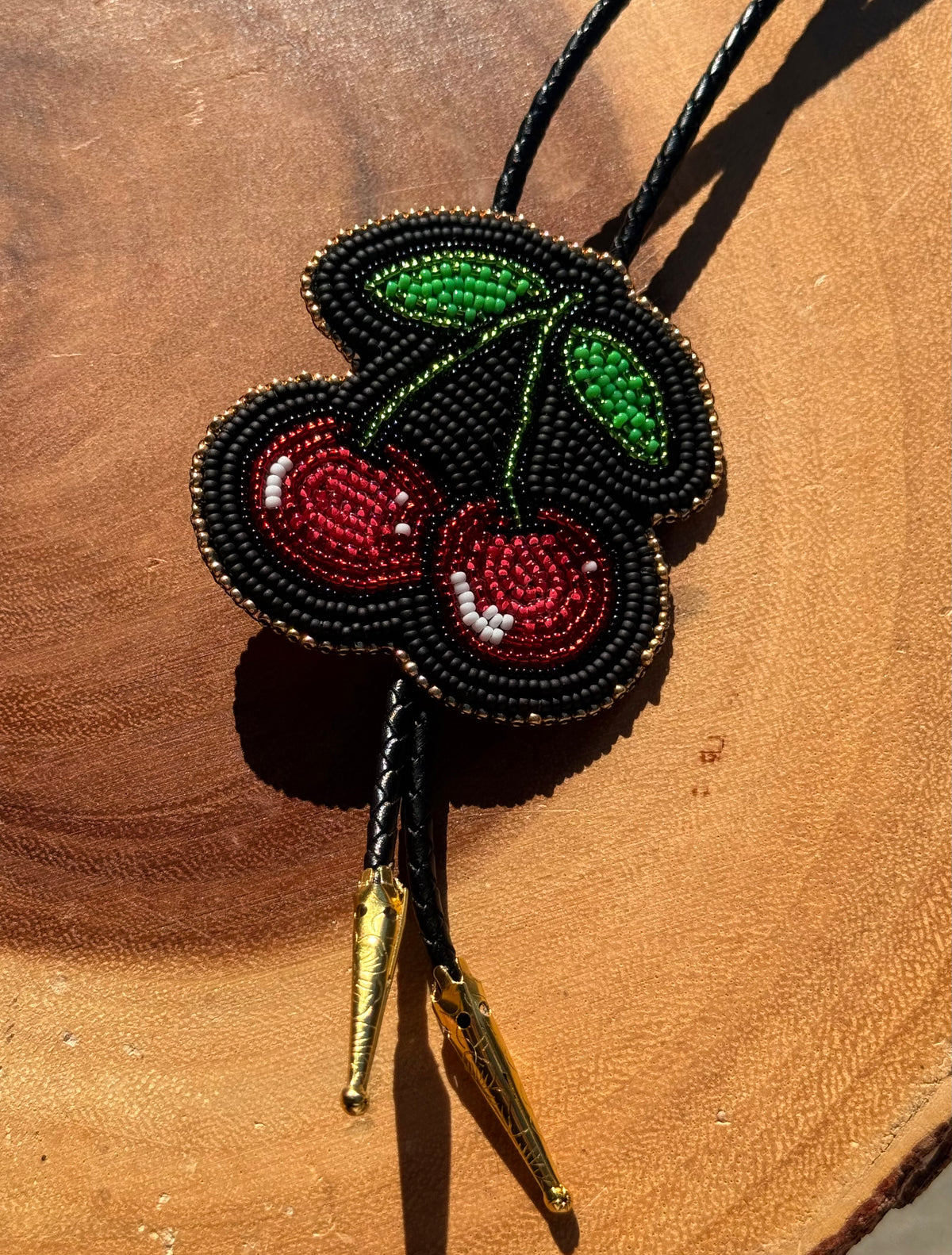 Flat Stitch Cherry Bolo Tie by Sinew and Sole
